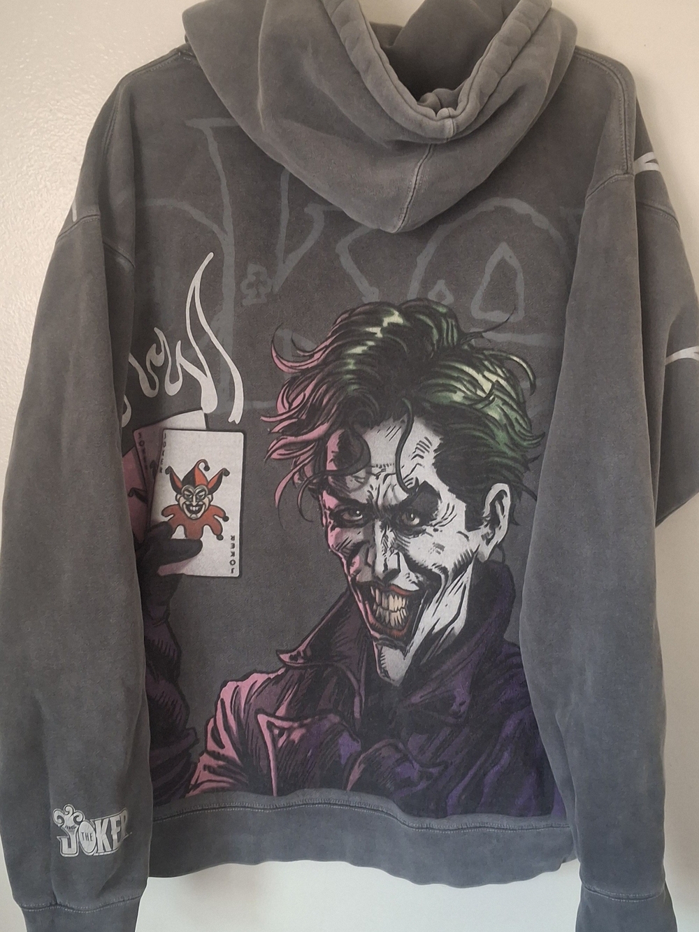 Comic-Style Joker Graphic Hoodie in Charcoal with Green & Purple Art